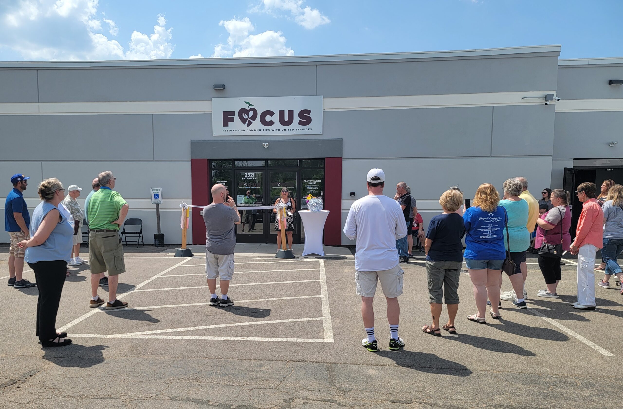 Open House - Mary Schultz, Chair of FOCUS, begins the opening ceremony to guests.