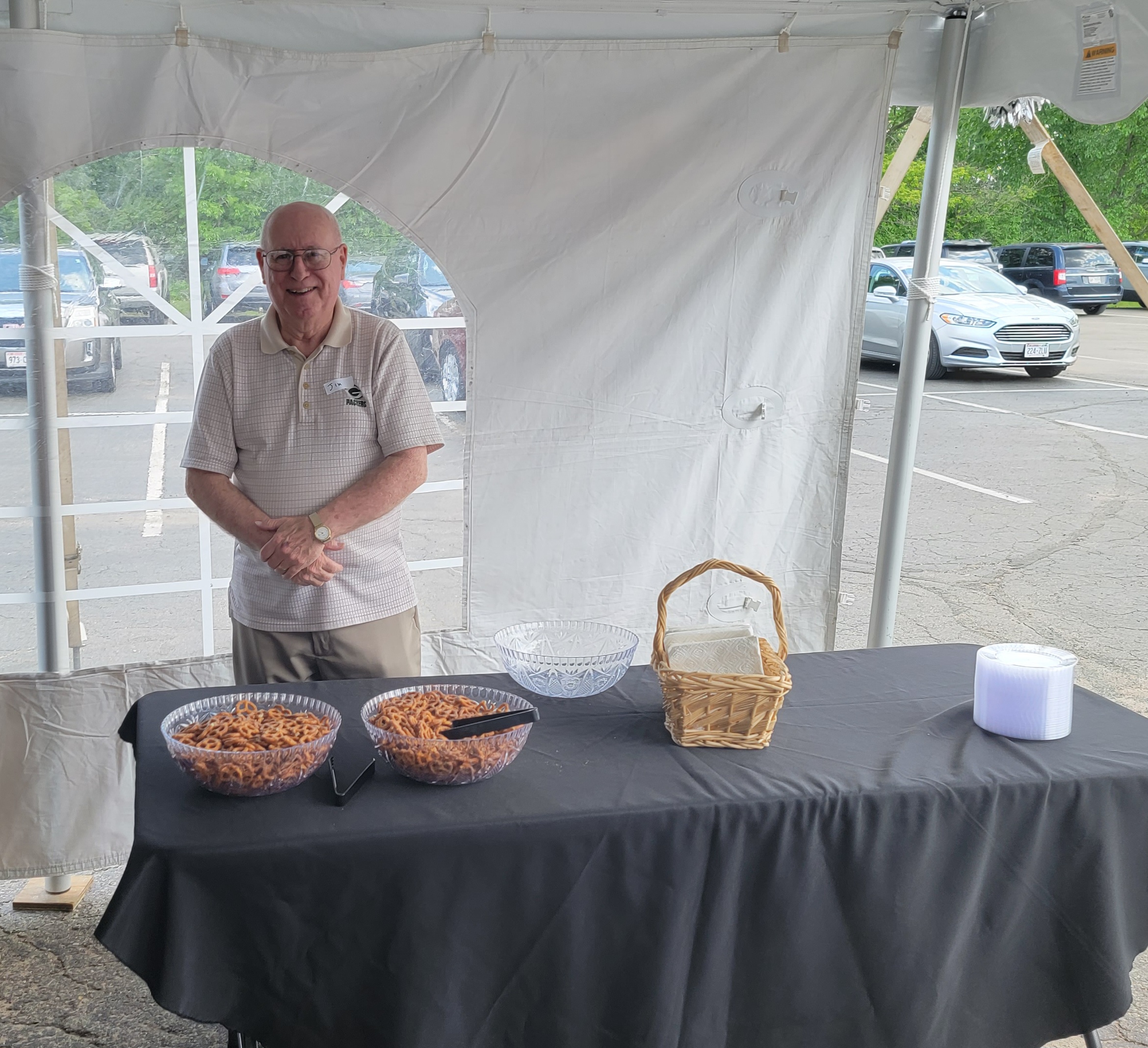 Open House volunteer serving up snacks.