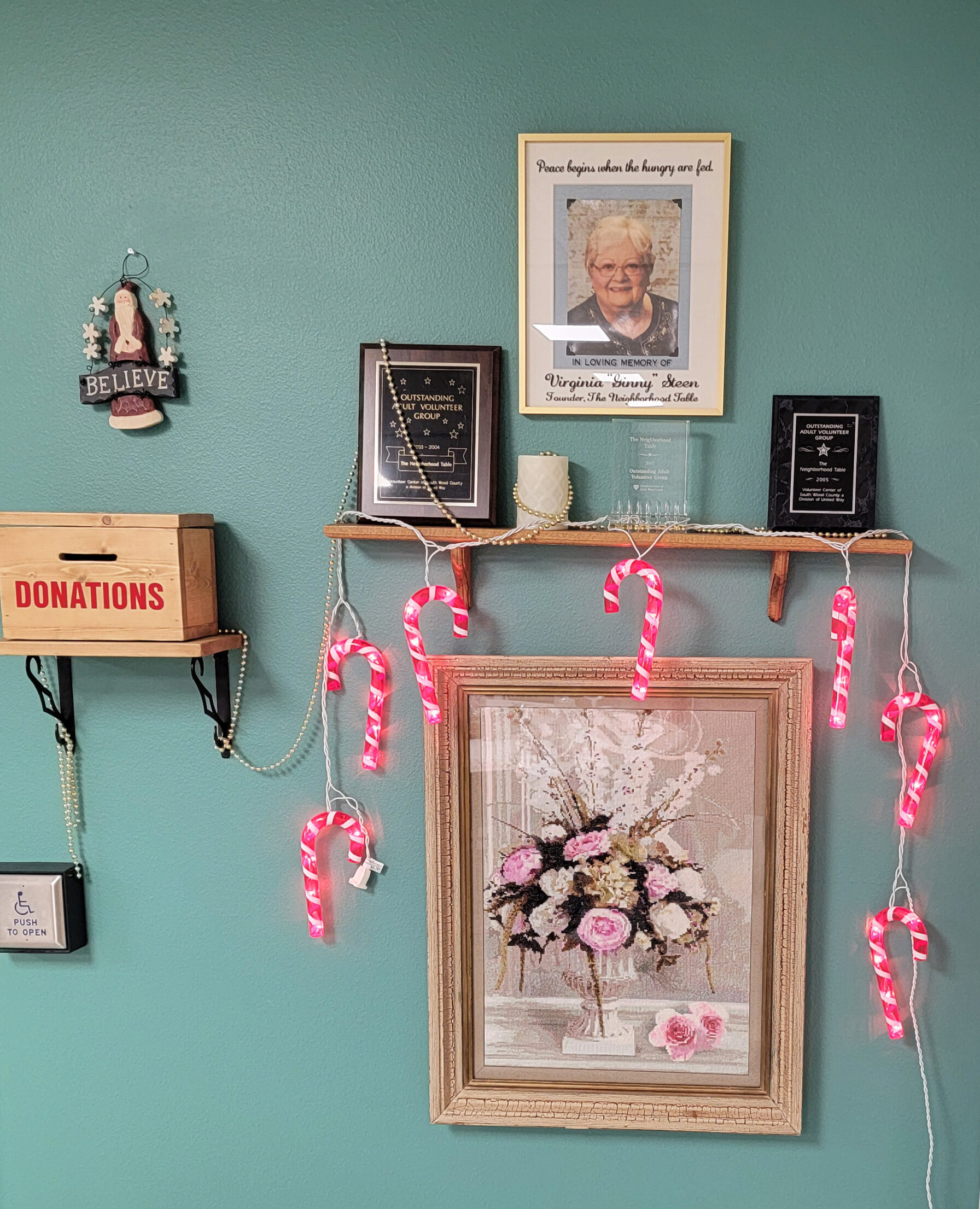 21st Anniversary Meal - Picture and plaques honoring Ginny Steen, Founder of The Neighborhood Table, now known as the FOCUS Neighborhood Meal Program.